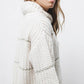 Maglione a righe in maglia con collo arricciato