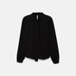 Blusa nera con fiocco al collo