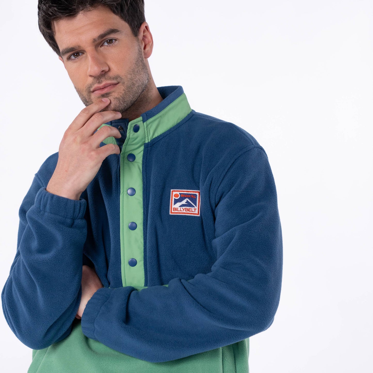 Felpa in pile bicolore blu navy e verde con bottoni