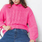 Maglione in maglia a trecce fucsia