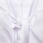 Top crop bianco con maniche a palloncino e cut-out