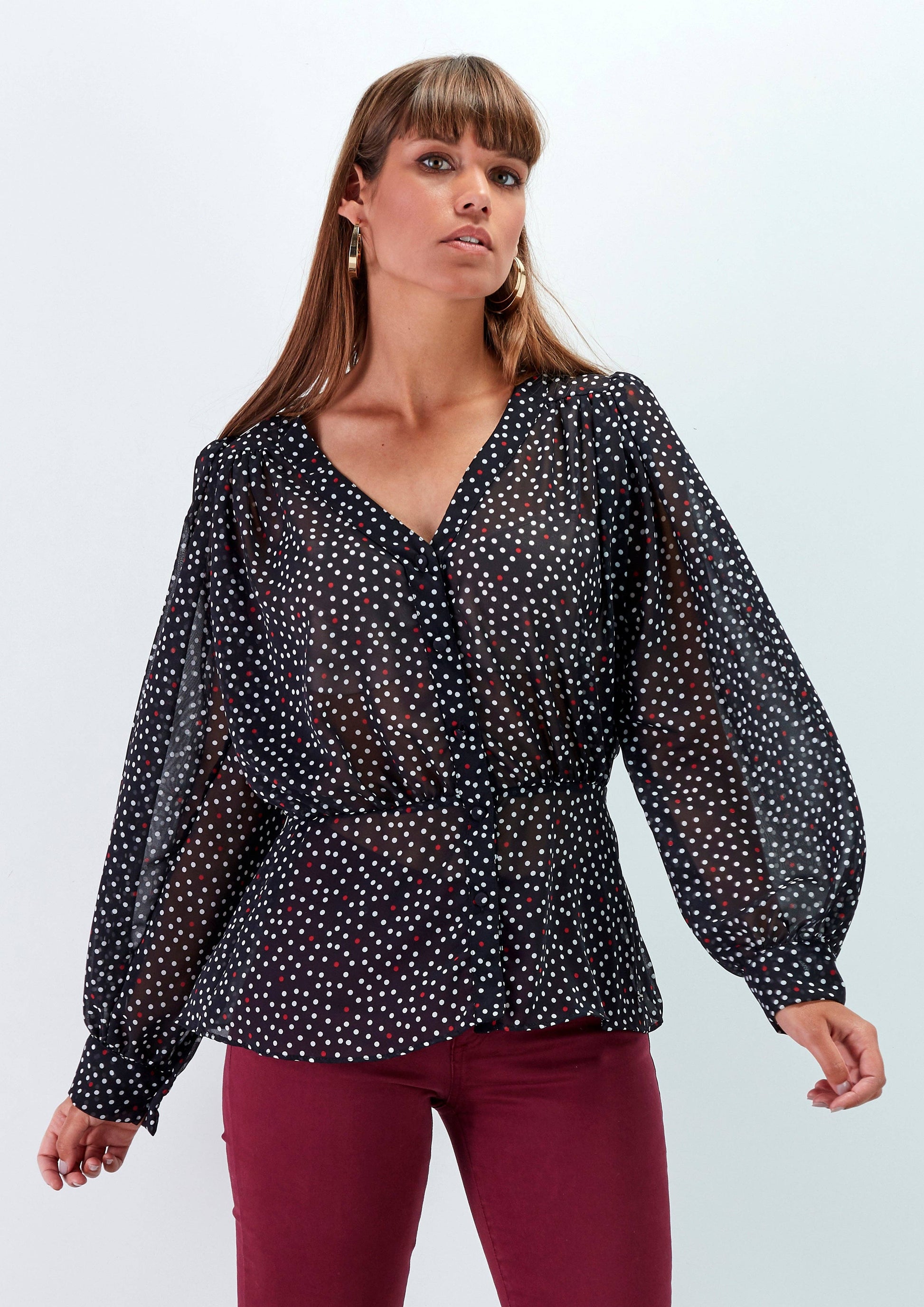 Blusa a pois con scollo a V e maniche morbide