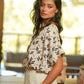 Blusa con stampa geometrica