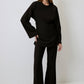 Blusa in crêpe nera con incrocio e lacci sul retro