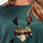 Maglione in maglia con paillettes a cuore