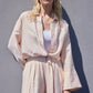 Completo donna camicia testurizzata con cintura e pantaloni palazzo