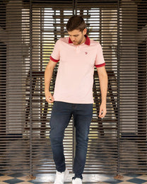 Polo antimacchia rosa con collo a contrasto