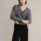 Maglione corto tweed con doppio scollo a V