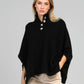Poncho maglia nero a collo alto con bottoni