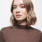 Maglione in maglia con dettagli metallici e collo alto
