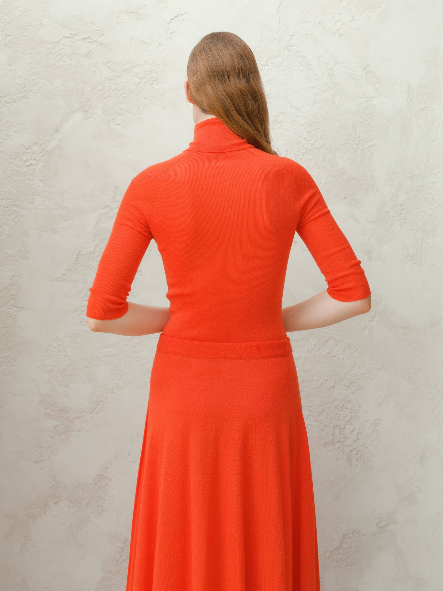 Dolcevita a coste in lana merino extrafine con manica 3/4