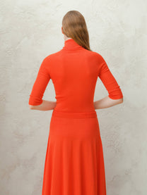 Dolcevita a coste in lana merino extrafine con manica 3/4
