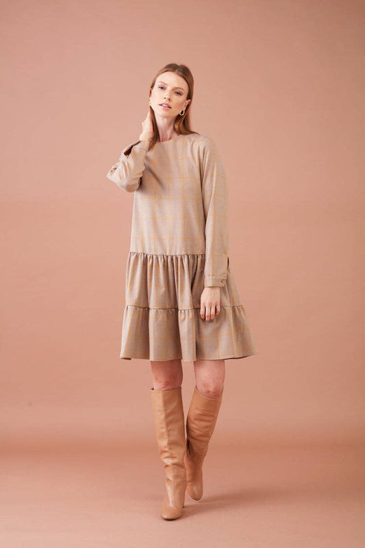 Abito a quadri beige con balze