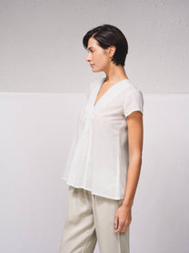 Blusa in cotone con scollo a V e volant