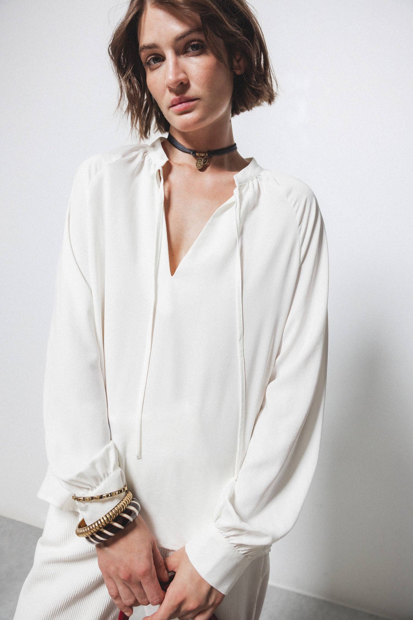 Blusa con coulisse e scollo arricciato
