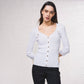 Cardigan in maglia a coste con catene dorate