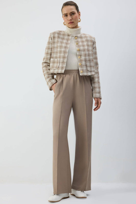 Pantaloni a pieghe con vita elasticizzata