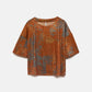 Blusa in tessuto strutturato con maniche a 3/4