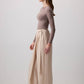 Pantaloni beige a gamba larga con cintura avvolgente