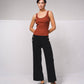 Pantaloni in maglia fine a coste con bottoni dorati