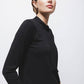 Maglione in maglia rasata con scollo a V e fiocco
