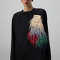 Tunica oversize nera con applicazione piumata multicolor