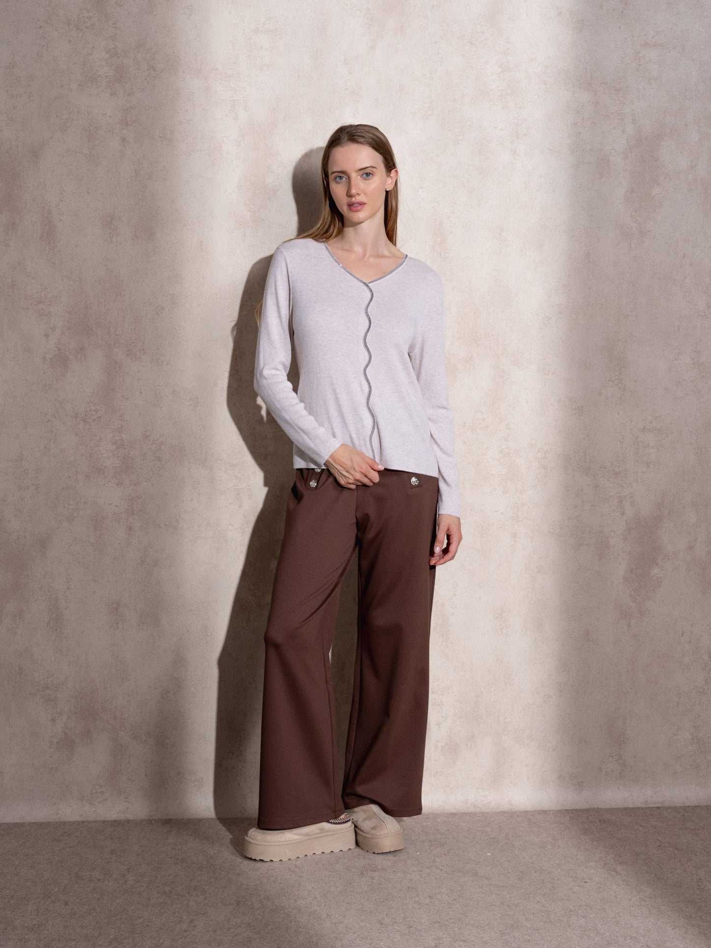 Maglione in maglia scintillante con profilo ondulato