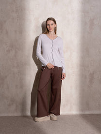 Maglione in maglia scintillante con profilo ondulato