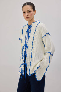 Cardigan in maglia con laccetti e profili a contrasto