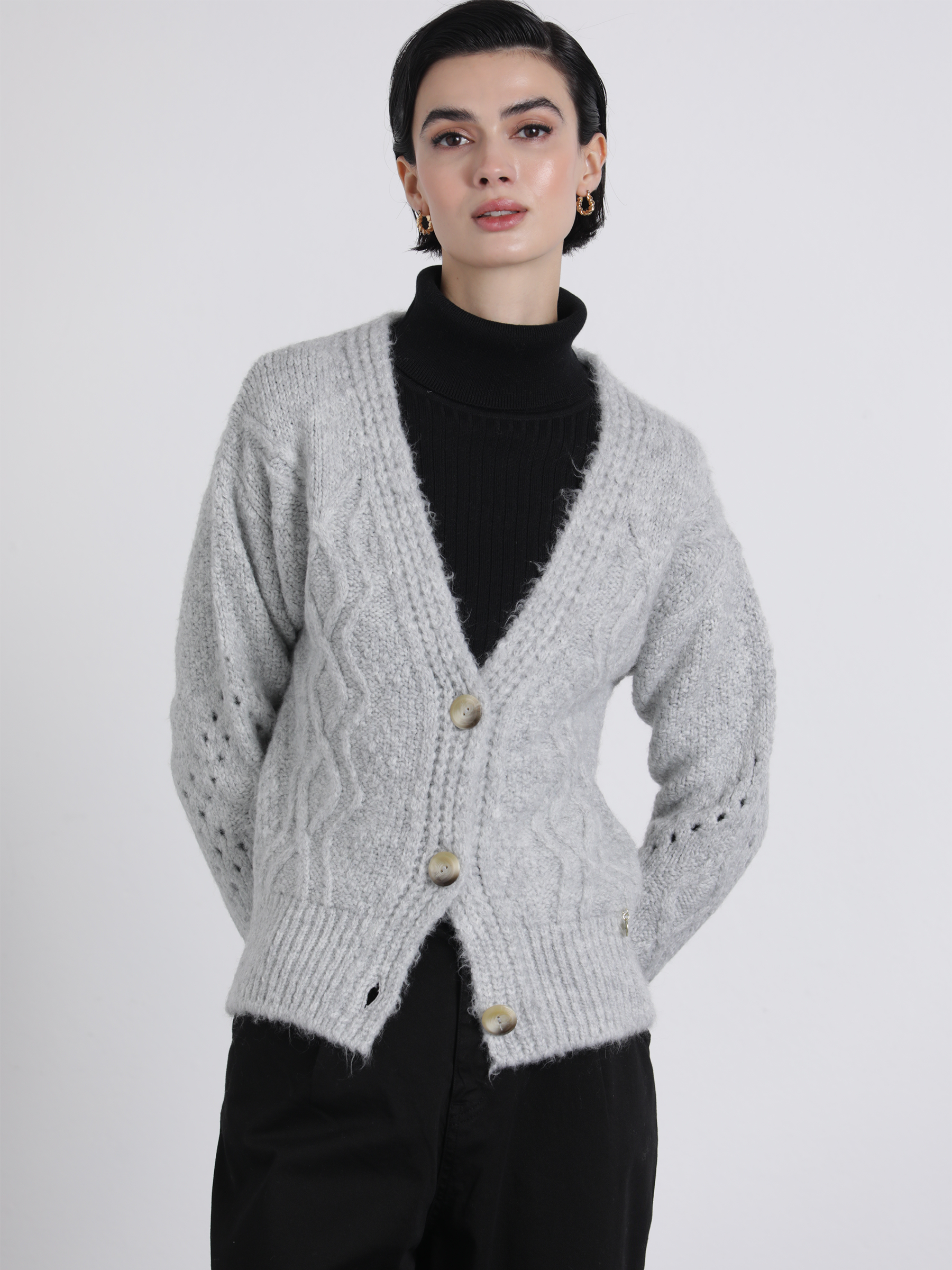 Cardigan in maglia traforata con bottoni