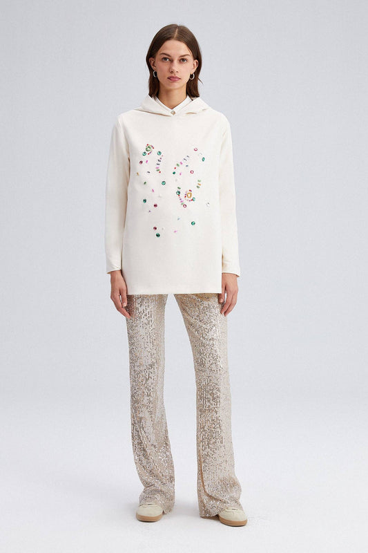 Tunica felpata con cappuccio color crema con applicazioni gioiello