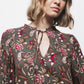 Blusa floreale con laccio al collo