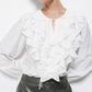 Blusa bianca con volant e laccio al collo