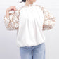 Blusa floreale con maniche a sbuffo