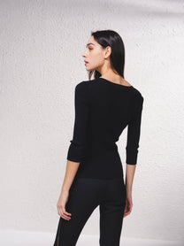 Cardigan in maglia a coste con catene dorate