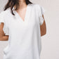 Blusa fluida con scollo a V e maniche arricciate