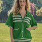 Completo in maglia traforata a righe con giacca e gonna