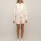 Shorts in raso con ricamo floreale