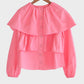 Blusa corta rosa con balze e maniche a sbuffo in misto cotone
