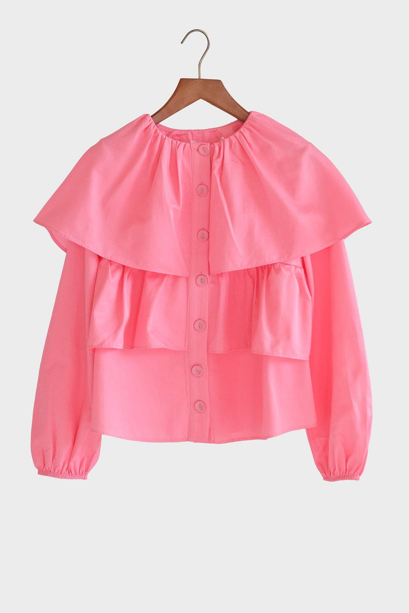 Blusa corta rosa con balze e maniche a sbuffo in misto cotone