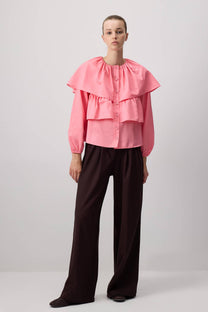 Blusa corta rosa con balze e maniche a sbuffo in misto cotone