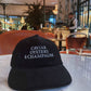 Cappellino in velluto a coste con ricamo “Caviar Oysters & Champagne”