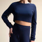 Top corto in maglia con frange sulle maniche
