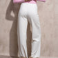 Pantaloni a palazzo a vita alta con bottoni decorativi