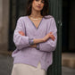 Maglia in maglia traforata con scollo a V
