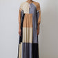 Abito lungo boho patchwork con laccio al collo e nappine