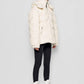 Piumino in eco shearling con cappuccio removibile