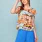Camicia pareo multicolor con scollo a barca e bottoni sul retro
