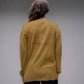 Maglione corto in maglia 3D con scollo a V asimmetrico e spacchi laterali
