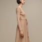 Abito midi in maglia lurex con gonna plissé e cintura